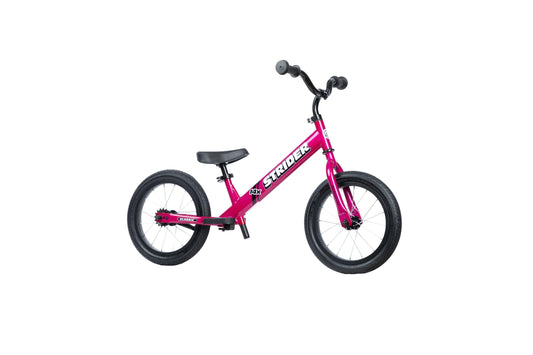 Strider 14x balance bike front view in Funky Fuschia boosts early confidence