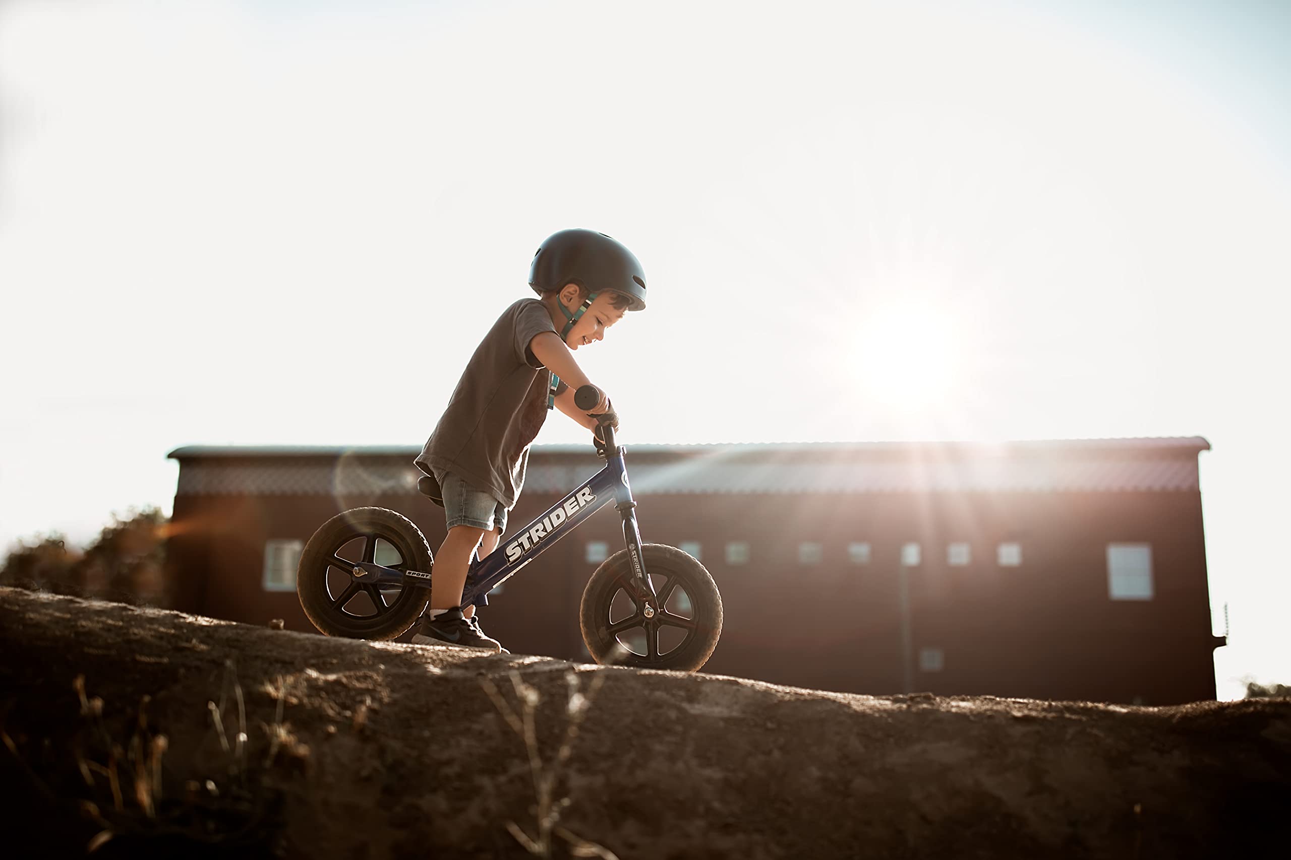 Strider balance bike 12-inch blue age-appropriate design for growing riders.