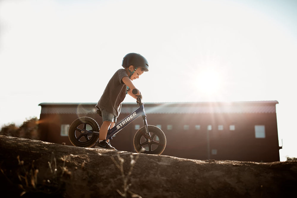 Strider balance bike 12-inch blue age-appropriate design for growing riders.