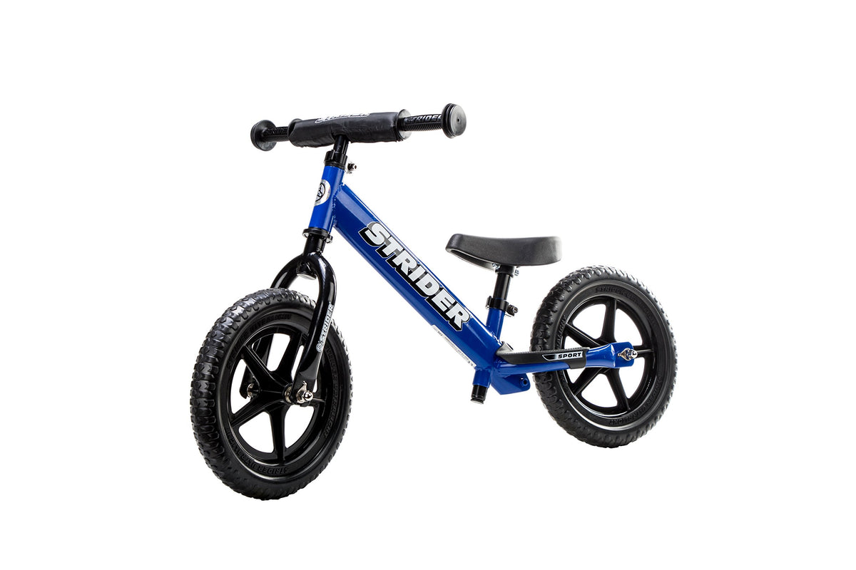 Strider balance bike 12-inch blue front view showing safe, lightweight design for young riders.