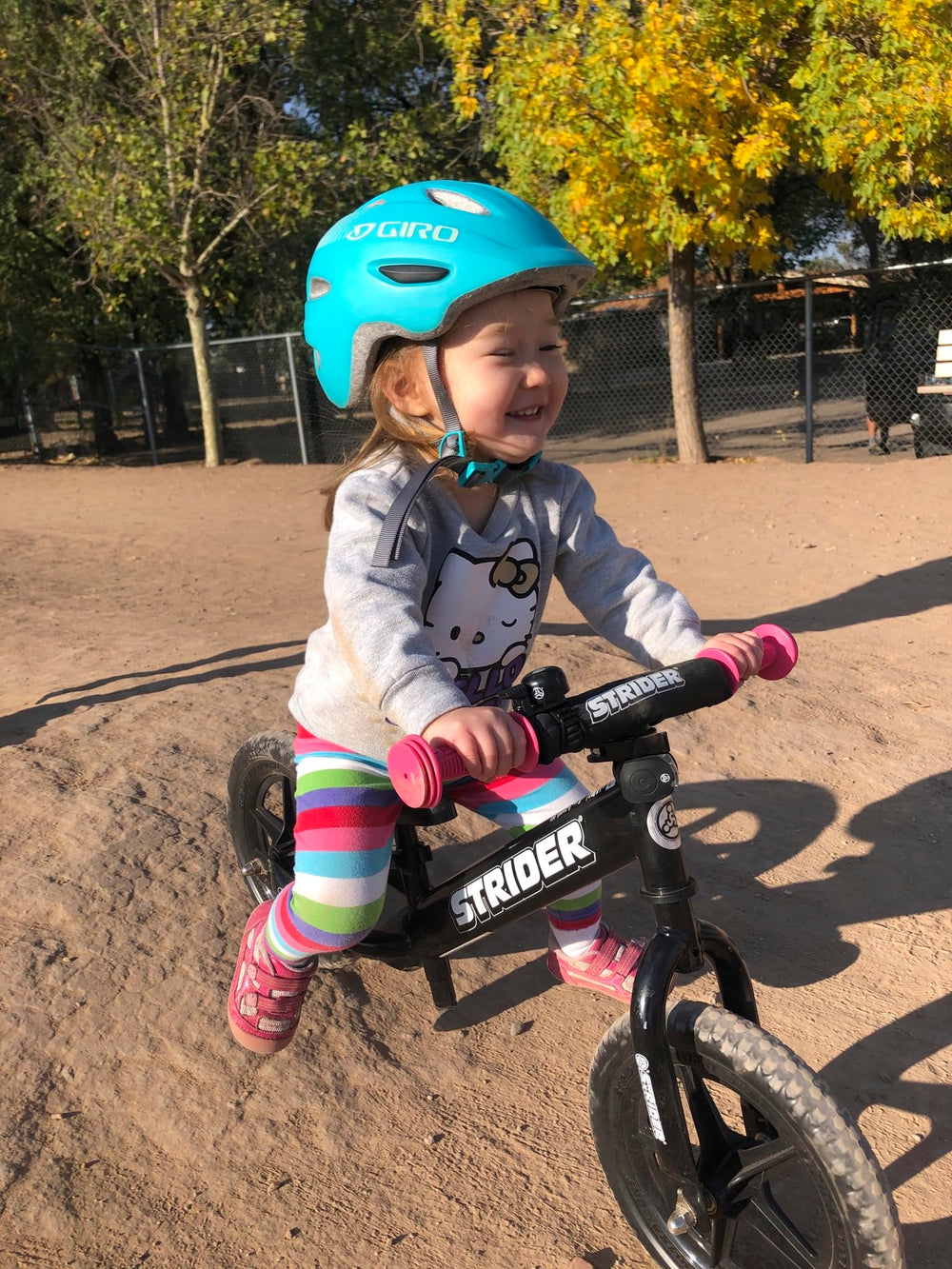 Strider safety pad and padded seat protect young riders on first rides.