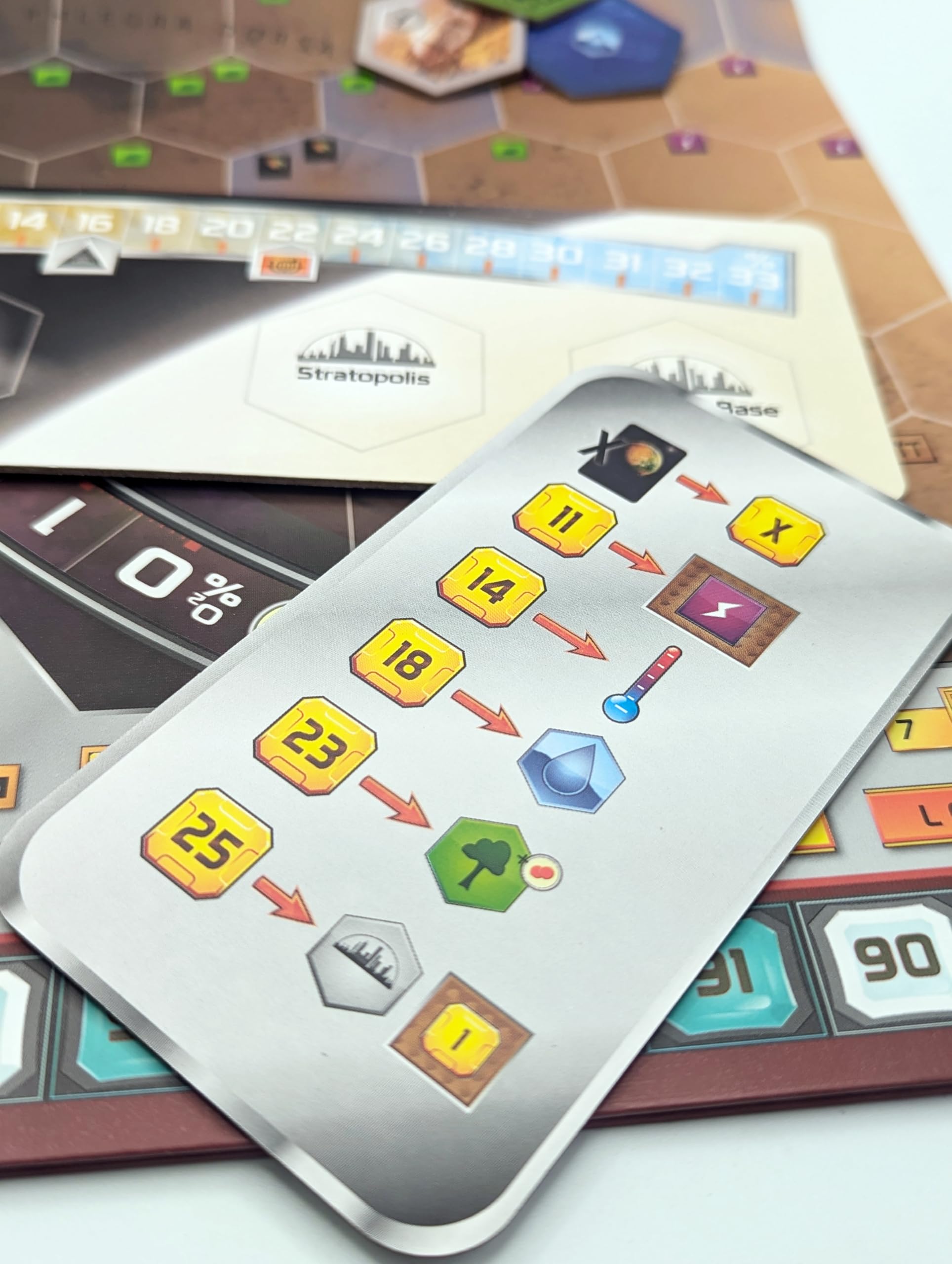 Stronghold Games Terraforming Mars milestones and awards tiles enhance scoring.