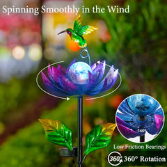 Blue cracked glass ball glows softly at night for gentle garden ambiance with Sunnylight.