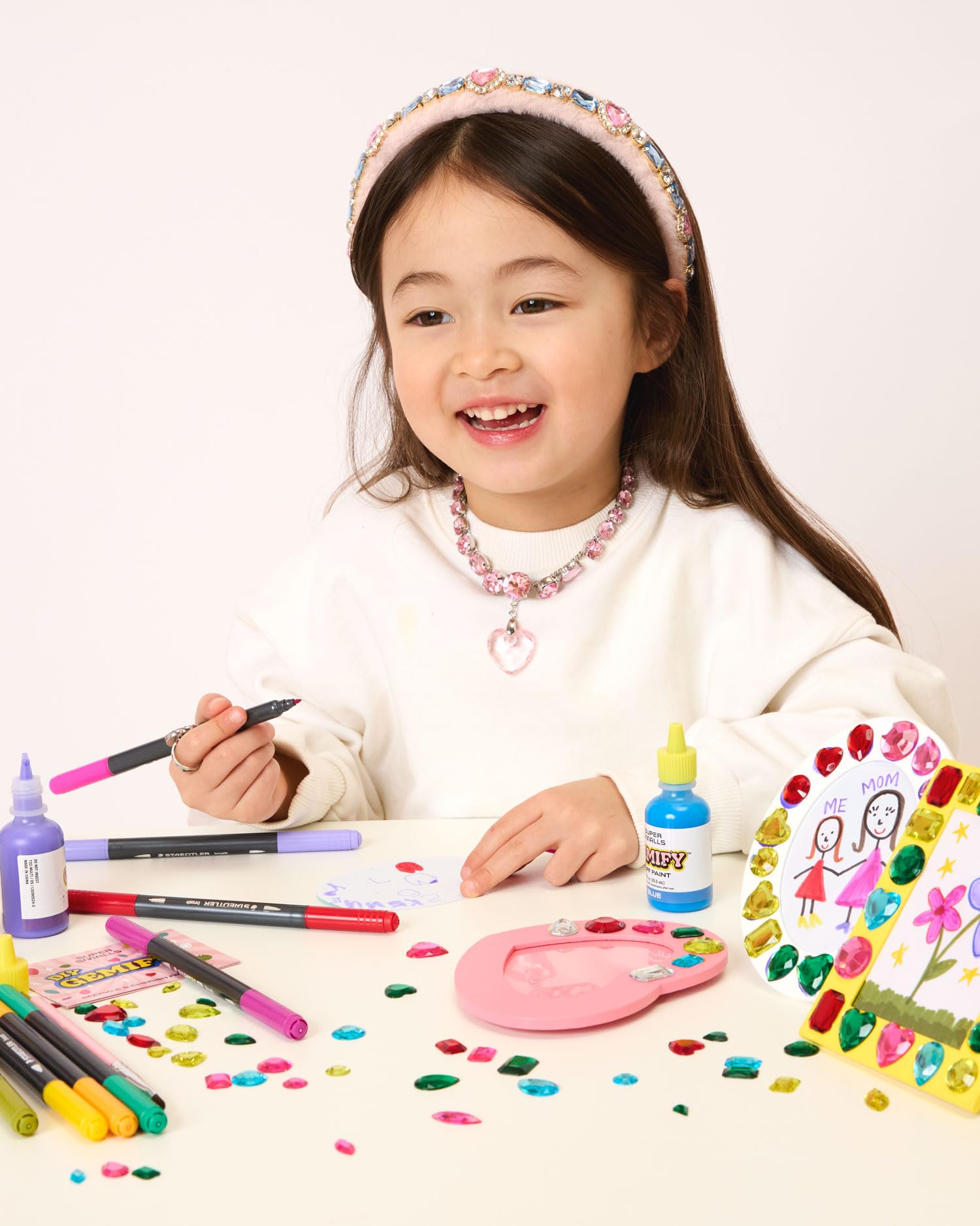 Super Smalls Sparkle and Cherish Frames Kit puff paint tubes add durable color for details.