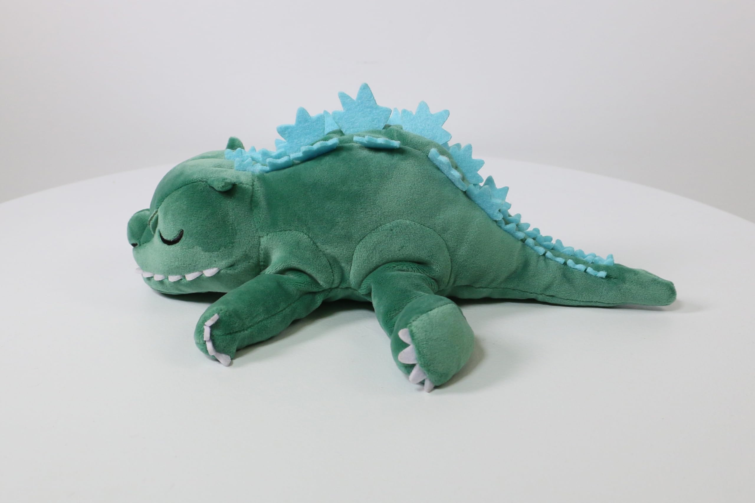 Surreal Entertainment Godzilla plush side view showing overall silhouette.