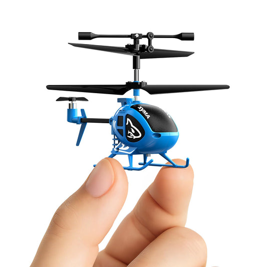 Syma mini RC helicopter in hand with shark pattern for indoor fun.