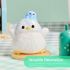 TabaSquishy blue penguin on a desk for quick focus breaks.