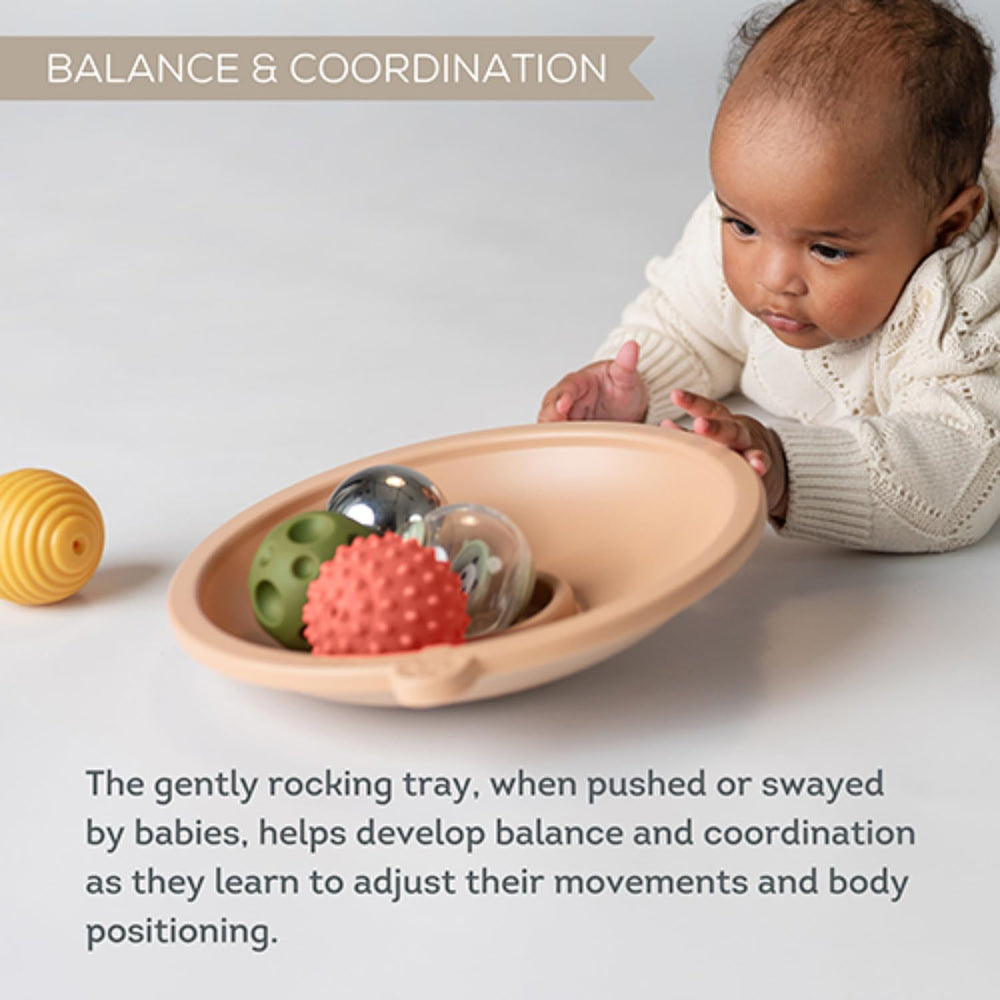Taf Toys core muscle development during tummy time with a swaying play tray.