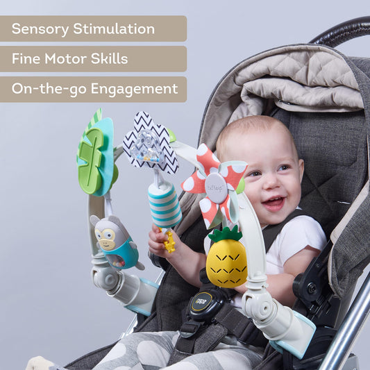 Taf Toys Tropical Arch attached to a stroller for on-the-go musical exploration