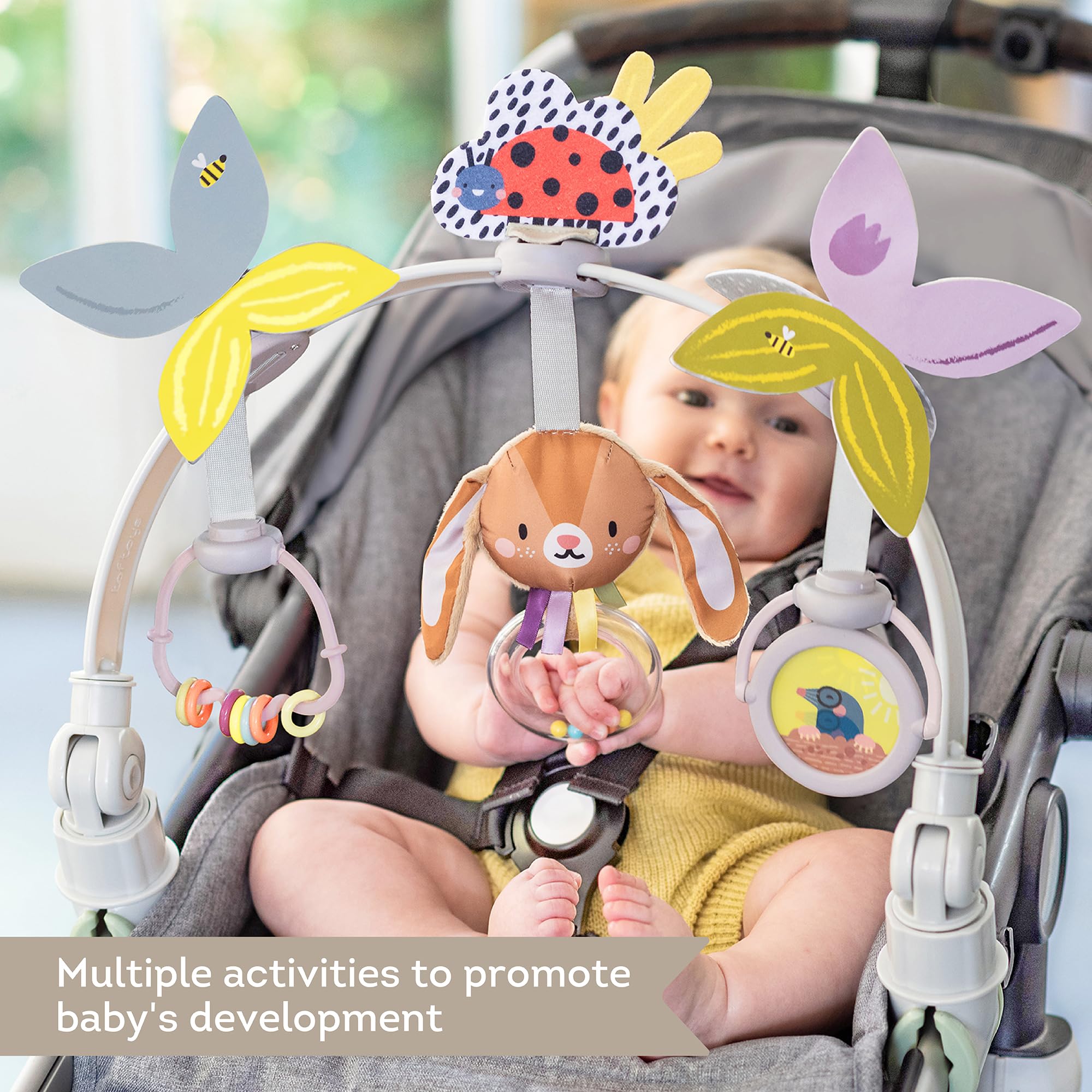 Taf Toys arch attached to car seat for on-the-go exploration and coordination