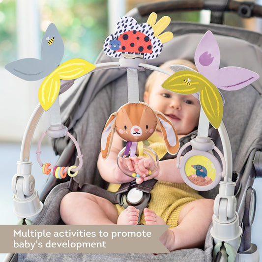Taf Toys arch attached to car seat for on-the-go exploration and coordination