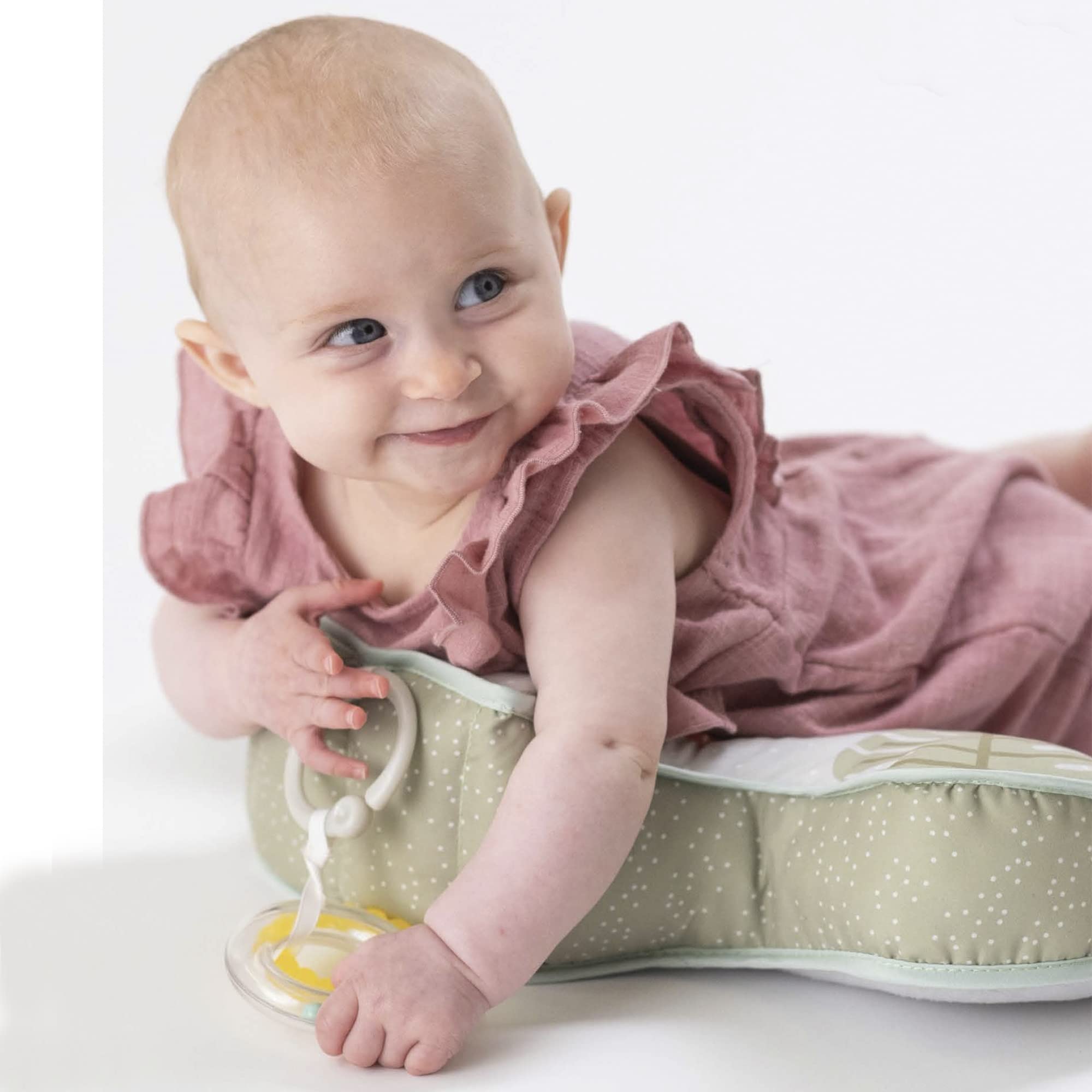 Baby interaction with Taf Toys cushion and interactive toys during play