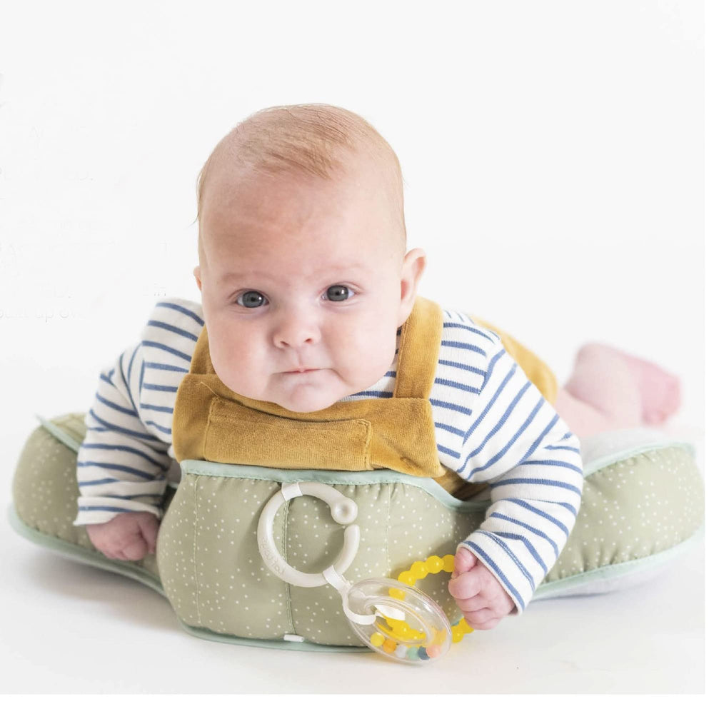 Baby slides and moves on Taf Toys cushion with supportive surface