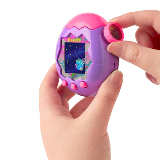 Tamagotchi Paradise Purple Sky nurturing play scene showing care and feedback