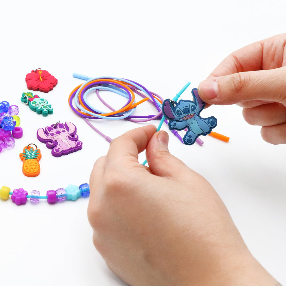 Tara Toys Stitch necklace in progress demonstrates easy, kid-friendly crafting steps.