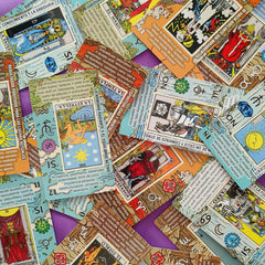 Tarotika two extra cards include chakra and planet guides for context