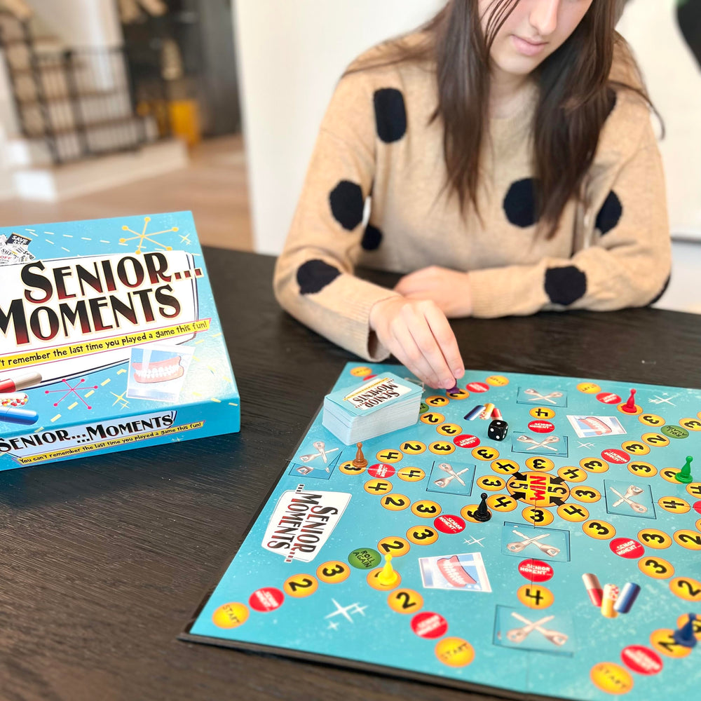 TDC Games Senior Moments cards: colorful prompts to challenge memory during game night.