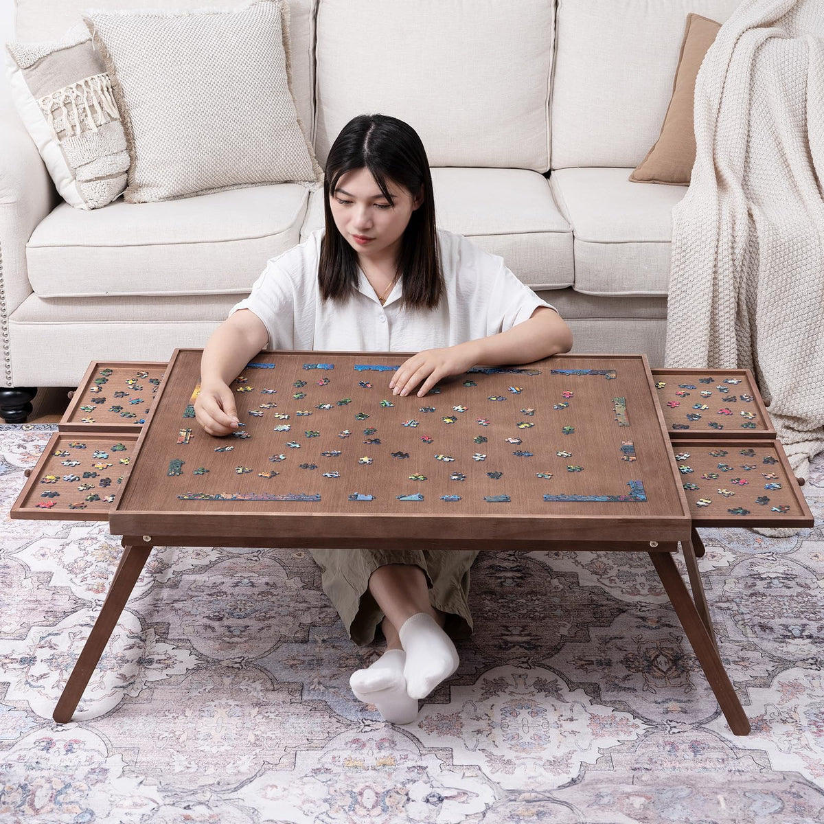 TEAKMAMA puzzle board with folding legs for comfortable seated puzzling.