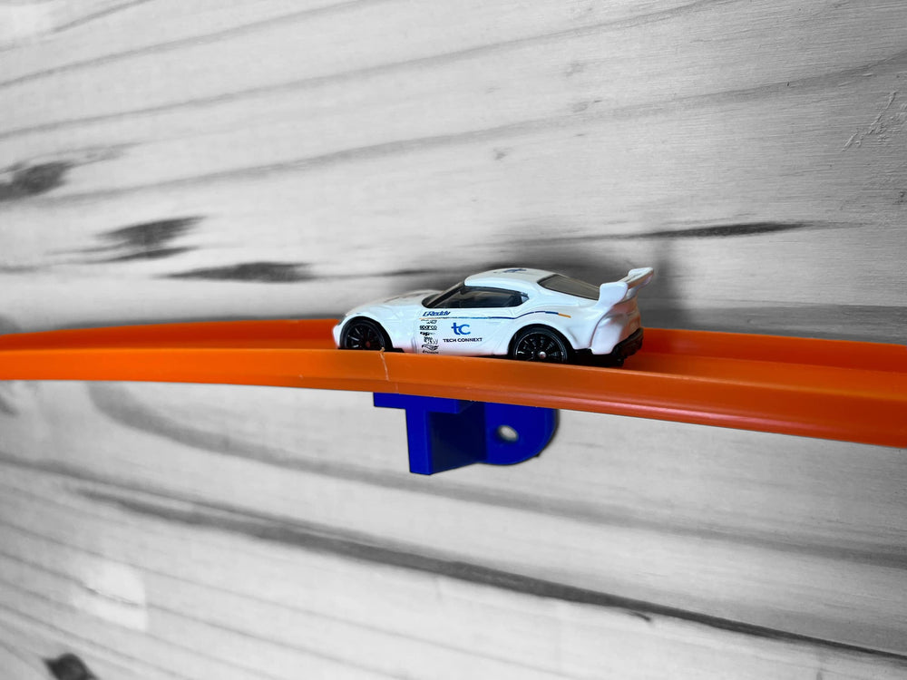 TechConnext 4-Pack blue wall mount demonstrates secure grip for 1/64 scale cars.