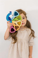 Tender Leaf Toys Peacock Colors acrylic tail windows encourage playful color mixing.