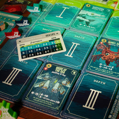Tettix Games Deep Regrets dice-and-energy scene emphasizes risk-reward decision making.