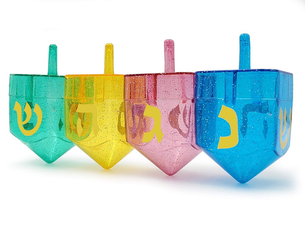 The Dreidel Company fillable dreidel shows symbols Nun Gimel Hay Shin for interactive play.