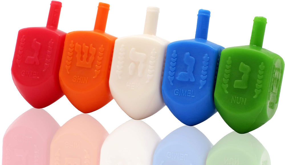 The Dreidel Company dreidels display foil-embossed Hebrew letters for authentic gameplay.