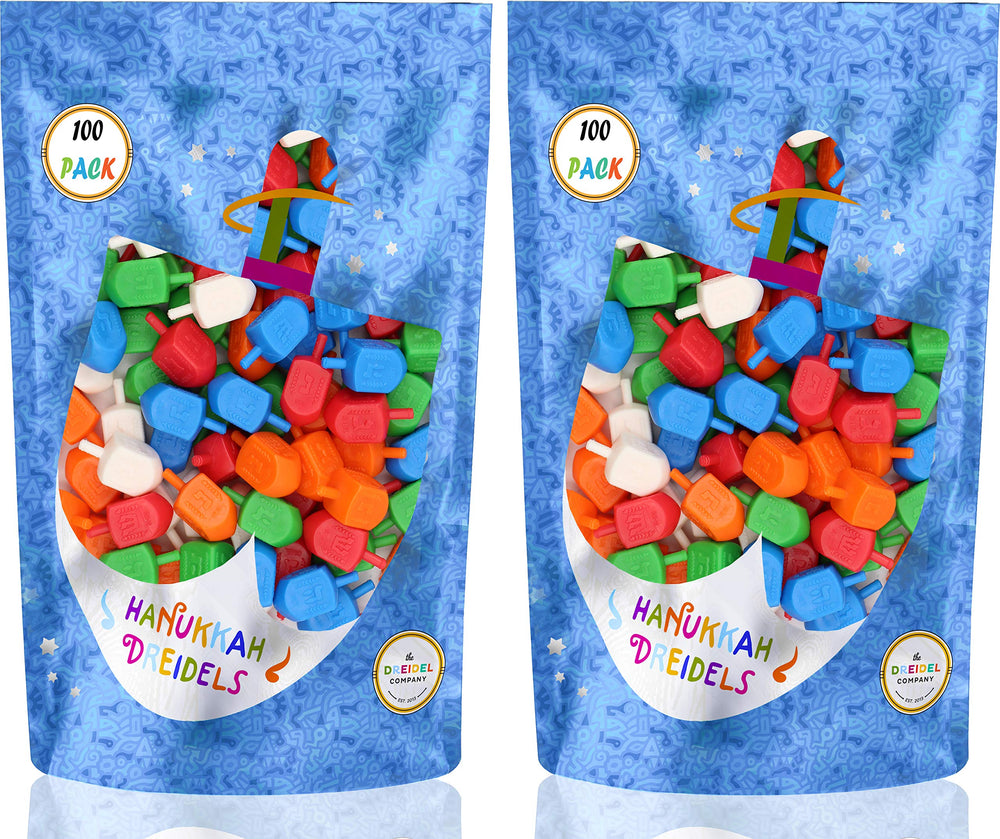 The Dreidel Company dreidels multicolor colors highlight foil-embossed Hebrew letters with translations.