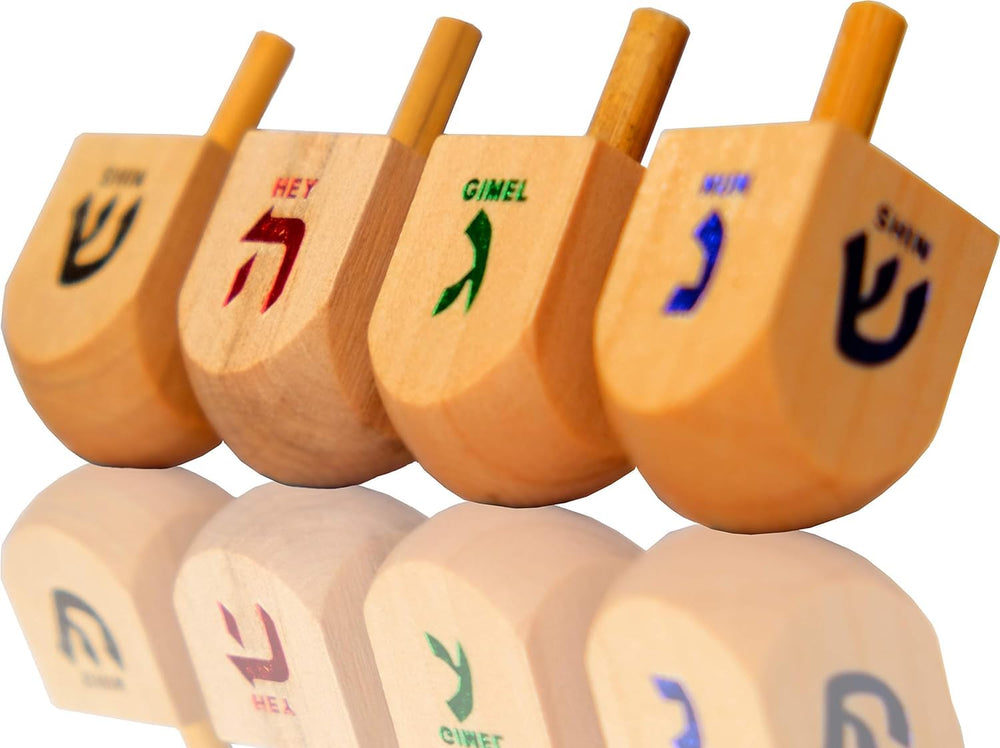 Kids enjoy spinning the wooden dreidel during family game night