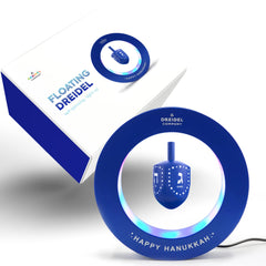 The Dreidel Company levitating dreidel ring showing magnetic suspension and rotation.