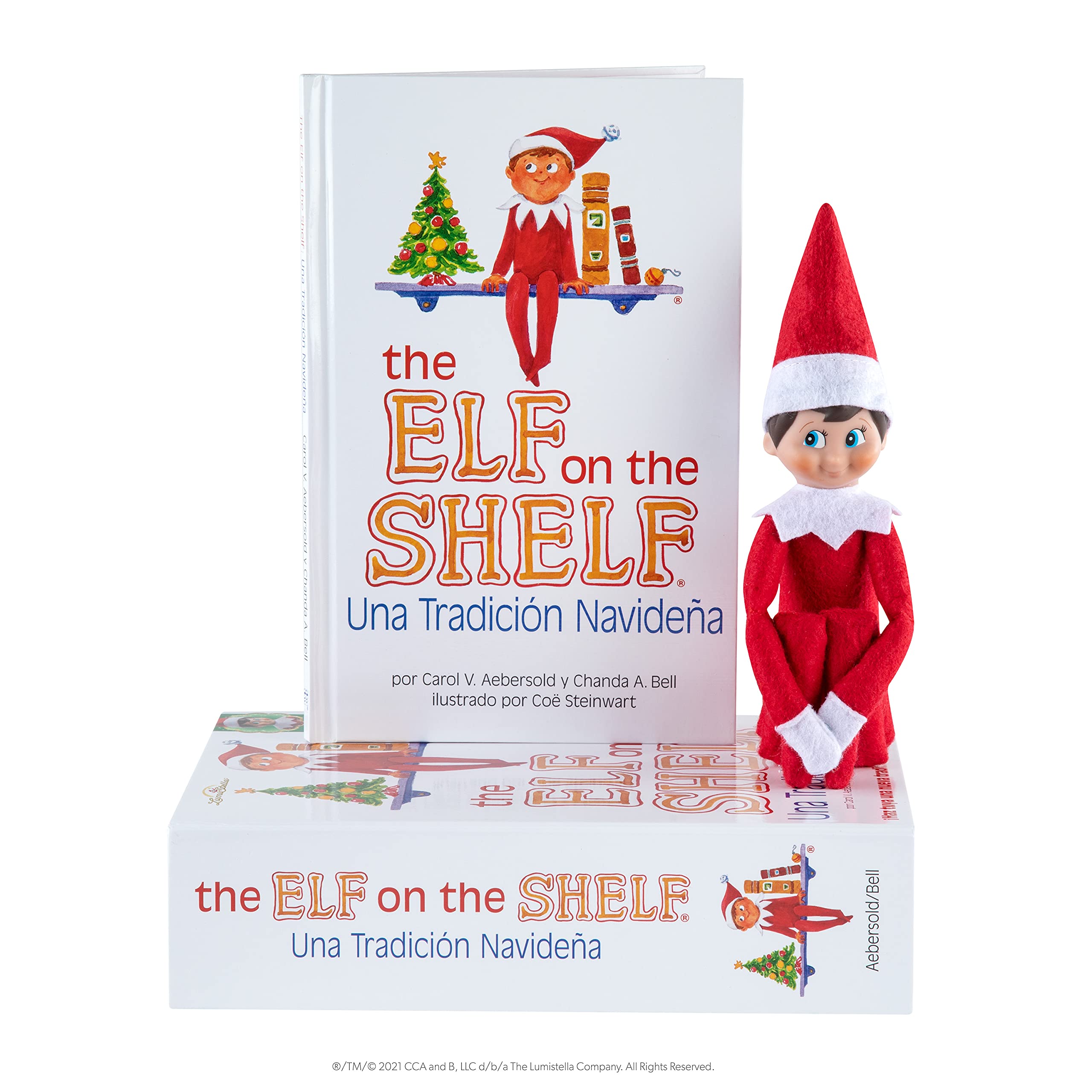 Blue-eyed scout elf beside The Elf on the Shelf book.