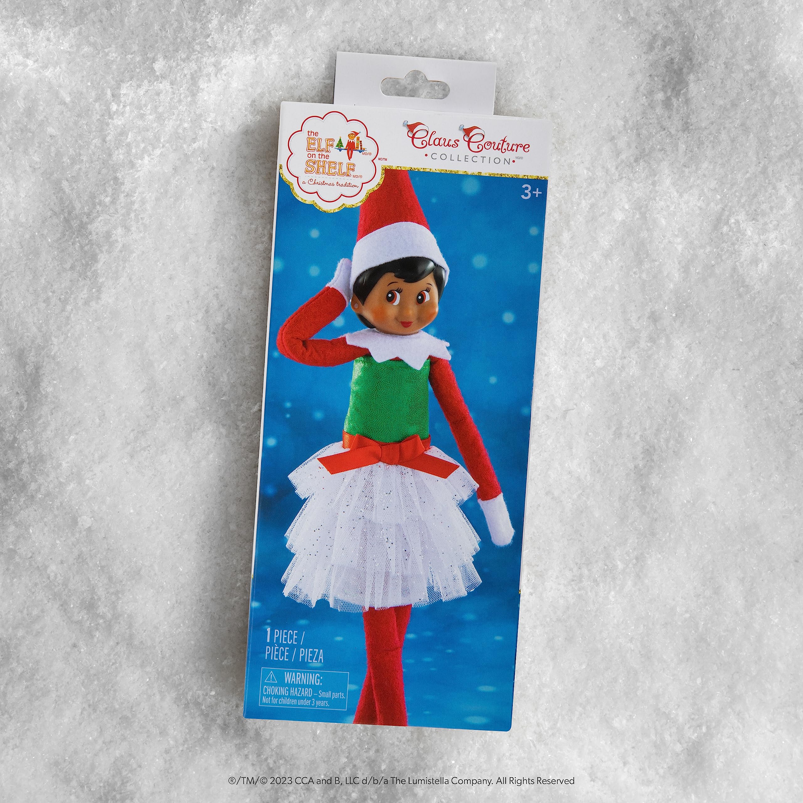 Model wearing the white elf-sized dress ready for a North Pole party.