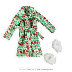 Elf relaxing by a cozy fire in Claus Couture robes sparks playful holiday moments.