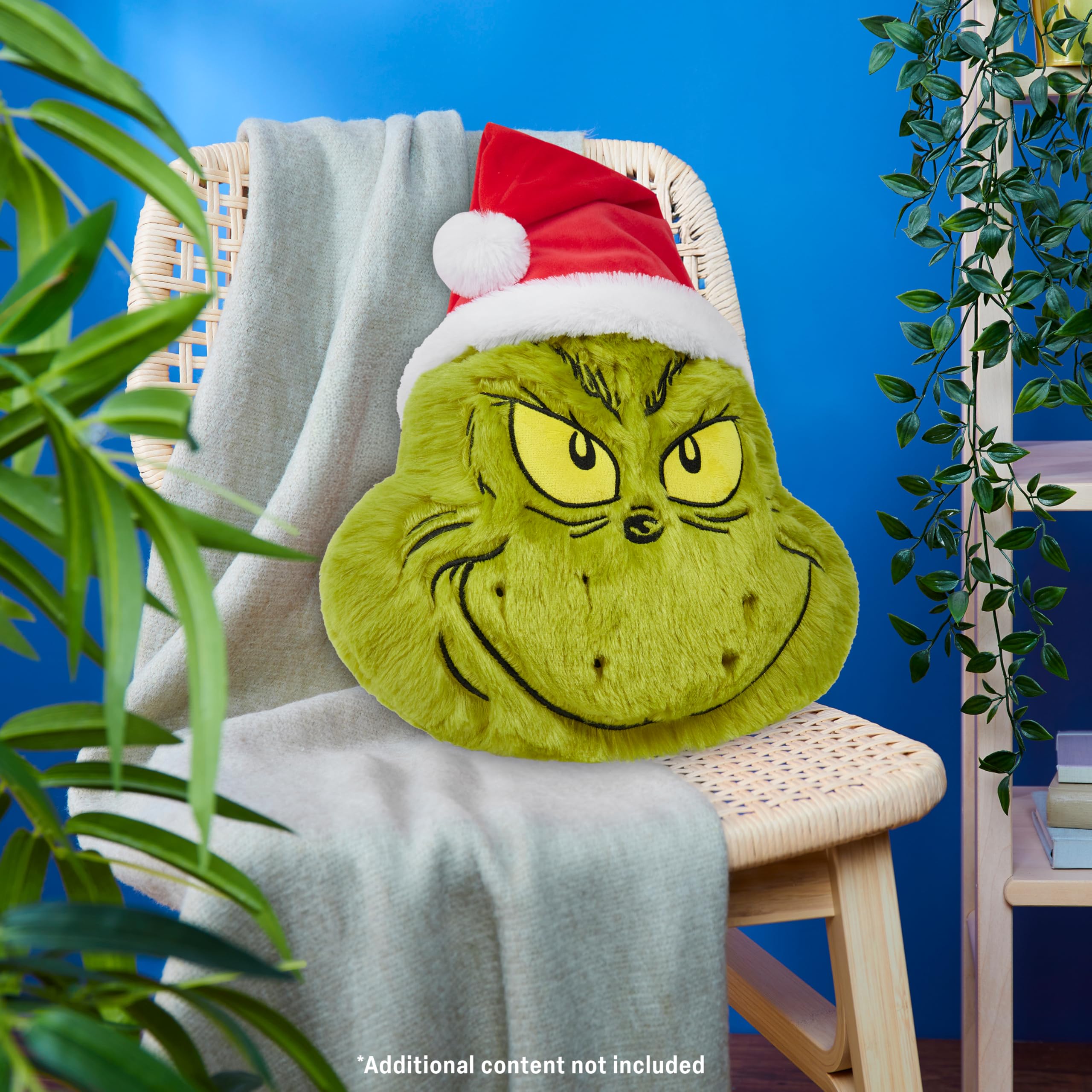 The Grinch plush pillow with soft polyester fabric offers cozy lounging.