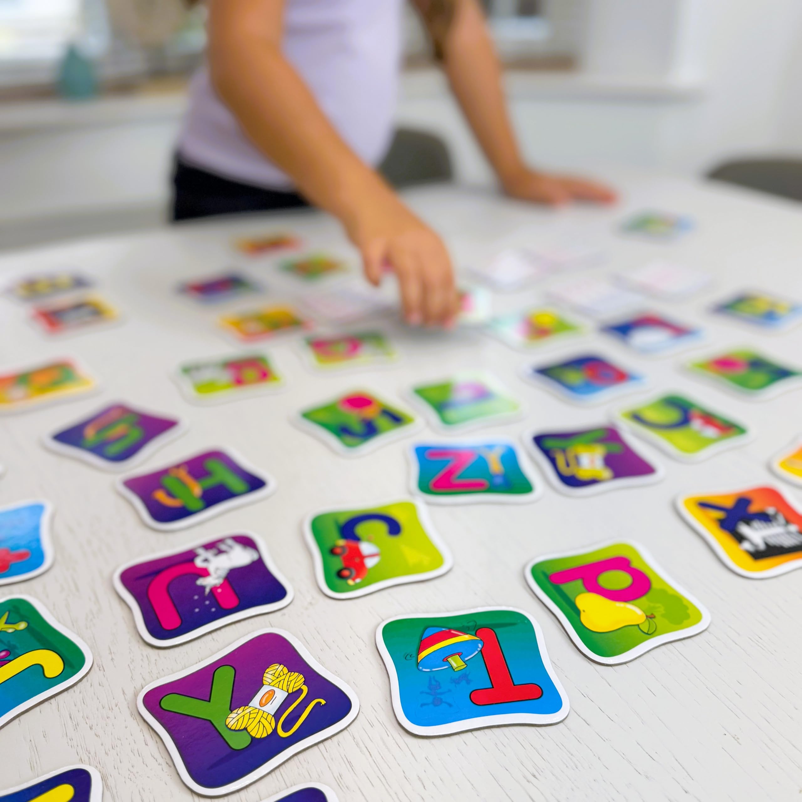 The Learning Journey child playing at a table demonstrating focus and cooperative learning benefits