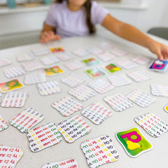 The Learning Journey size comparison in a hand showing compact, travel-friendly card set