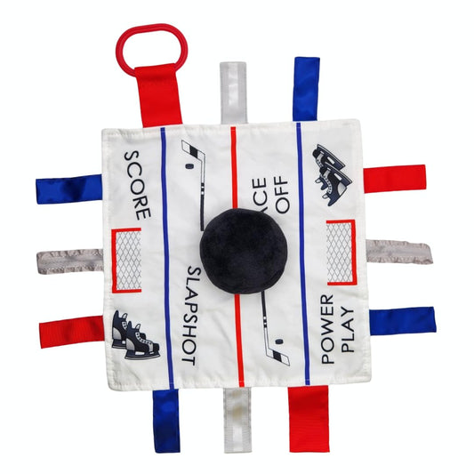 The Learning Lovey Hockey Puck Lovey Tag Toy with soft crinkles for sensory exploration on the go.