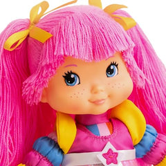 Close up of The Loyal Subjects Rainbow Brite Tickled Pink face with freckles and blue eyes.