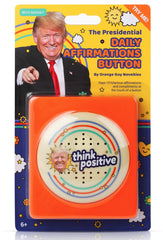 The Monocle Breakers Trump button on desk delivering 15 compliments to boost mood.