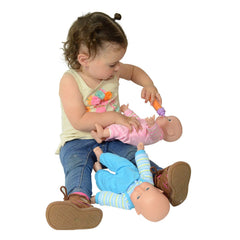 The New York Doll Collection twins in matching pink and blue outfits for coordinated play.