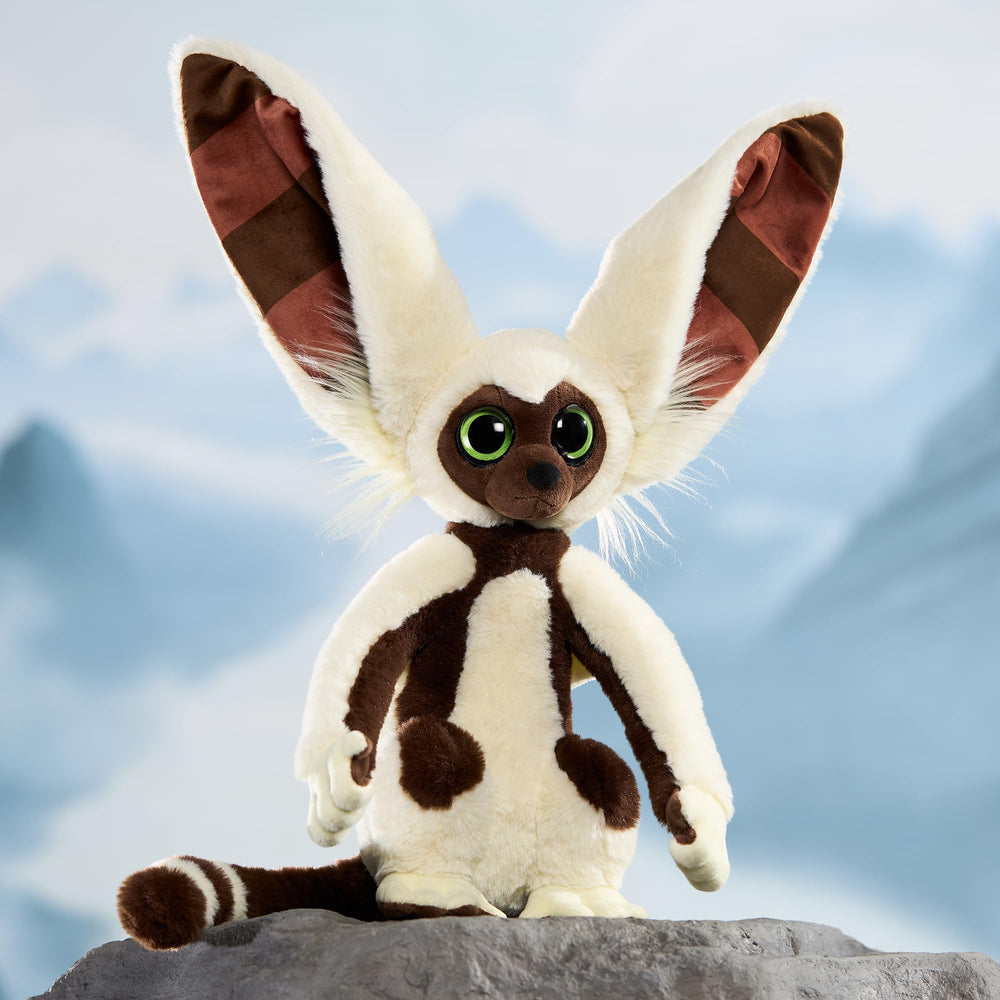 The Noble Collection Momo plush logo tag close-up confirms brand authenticity.