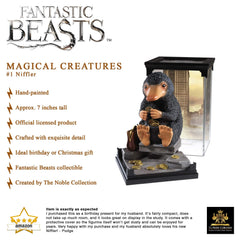 The Noble Collection Niffler removable cover enables pose versatility.