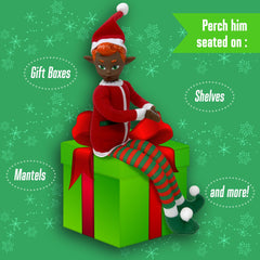 The Original Elf dangling-legs elf toy adds whimsy as a tree topper.