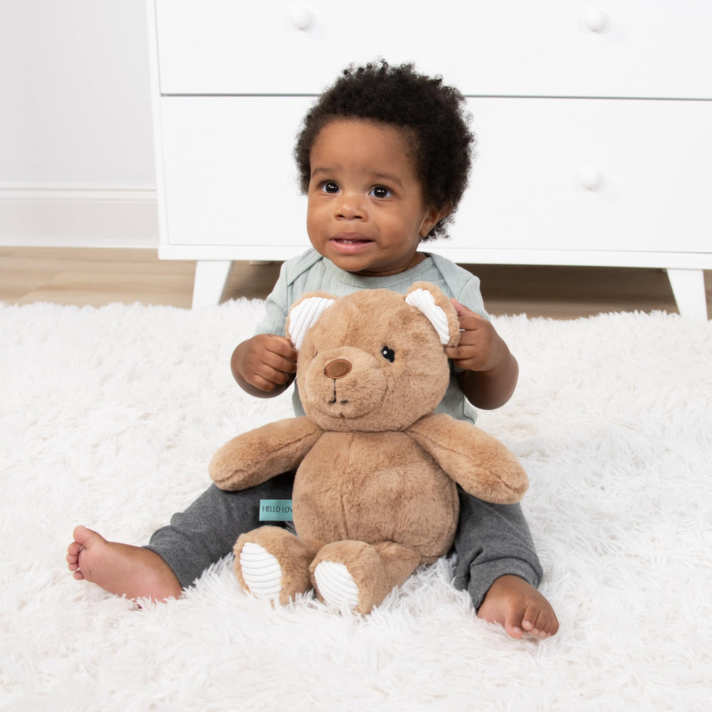 The Peanutshell Benny bear enhances woodland nursery decor with softness
