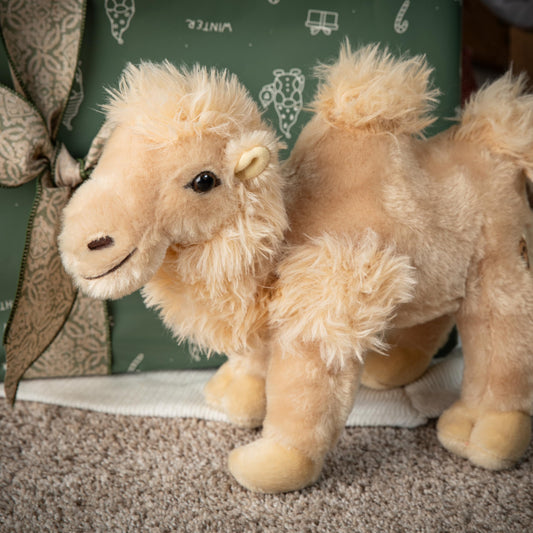 The Petting Zoo Bactrian camel plush smiling face invites cozy hugs during storytime.