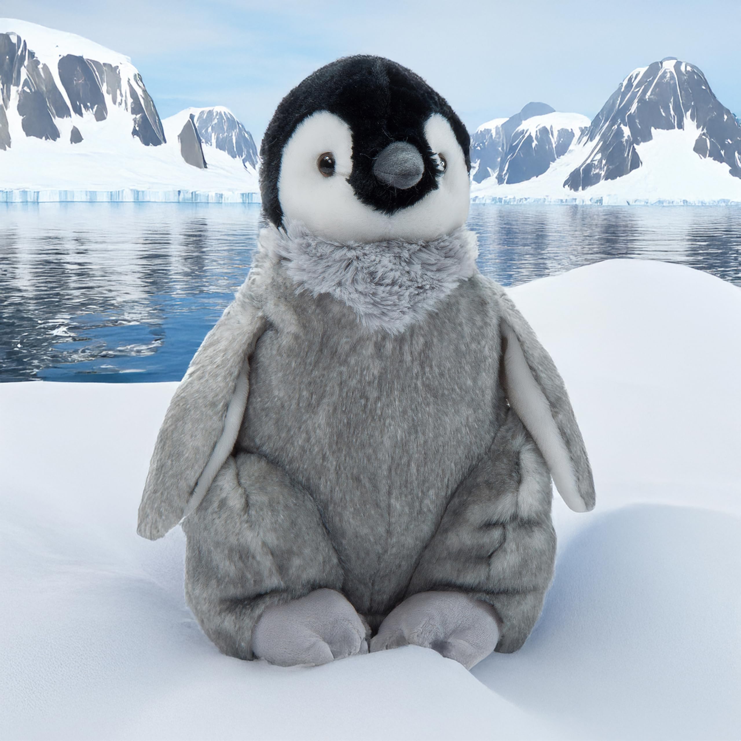 The Petting Zoo Penguin Chick stuffed animal, side view, perfect travel companion for kids' adventures.