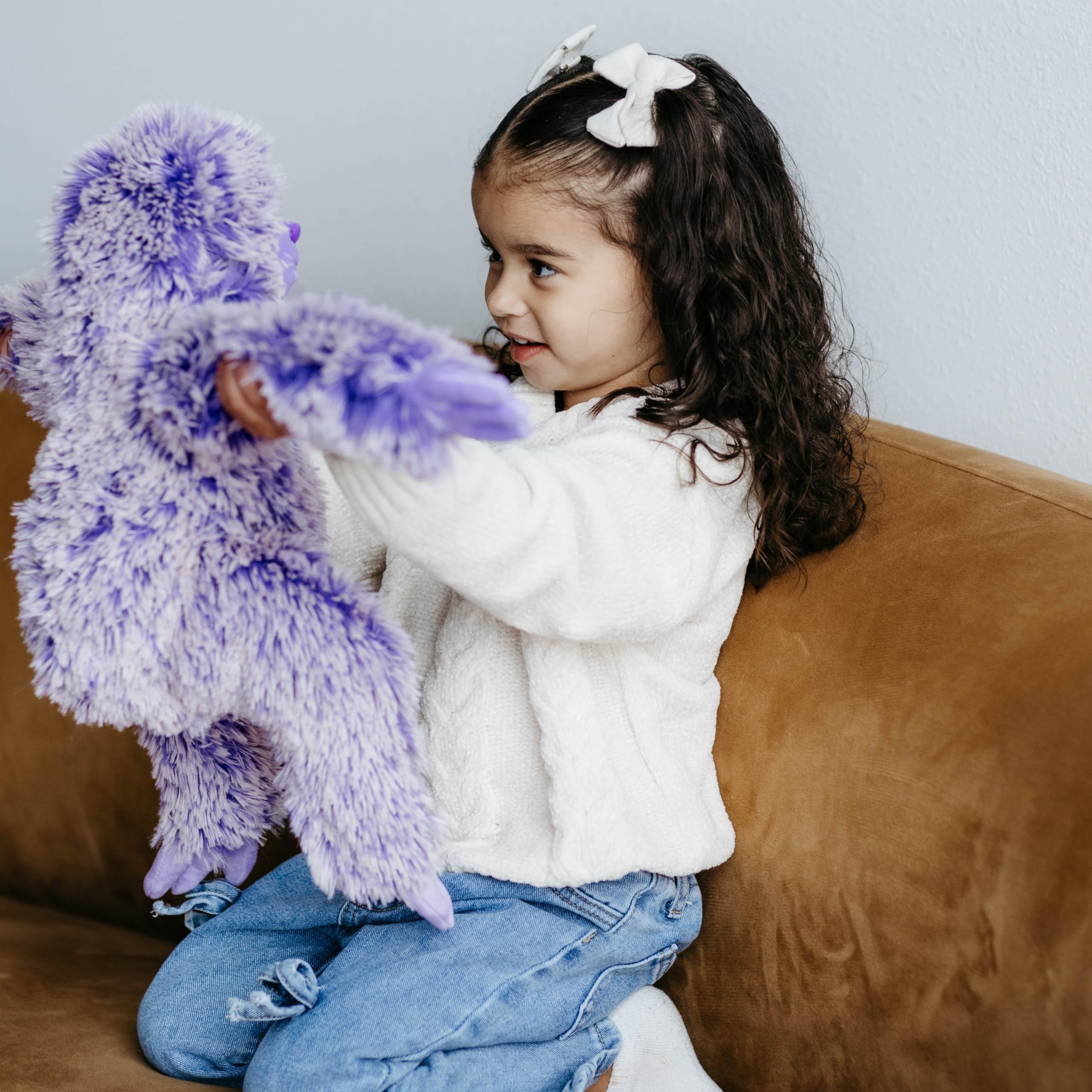 The Petting Zoo purple sloth plush enhances child playtime storytelling.
