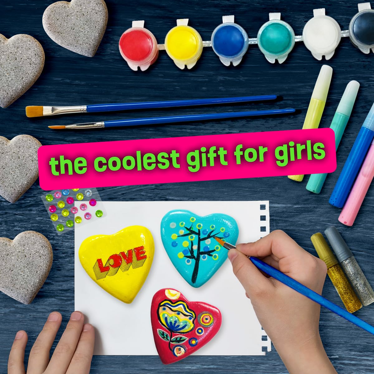 Child painting with The Scholar Ant Hearts Rock Kit during a craft session