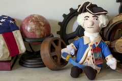 The Unemployed Philosophers Guild George Washington doll with black tri-corner hat—playful history-inspired decor.