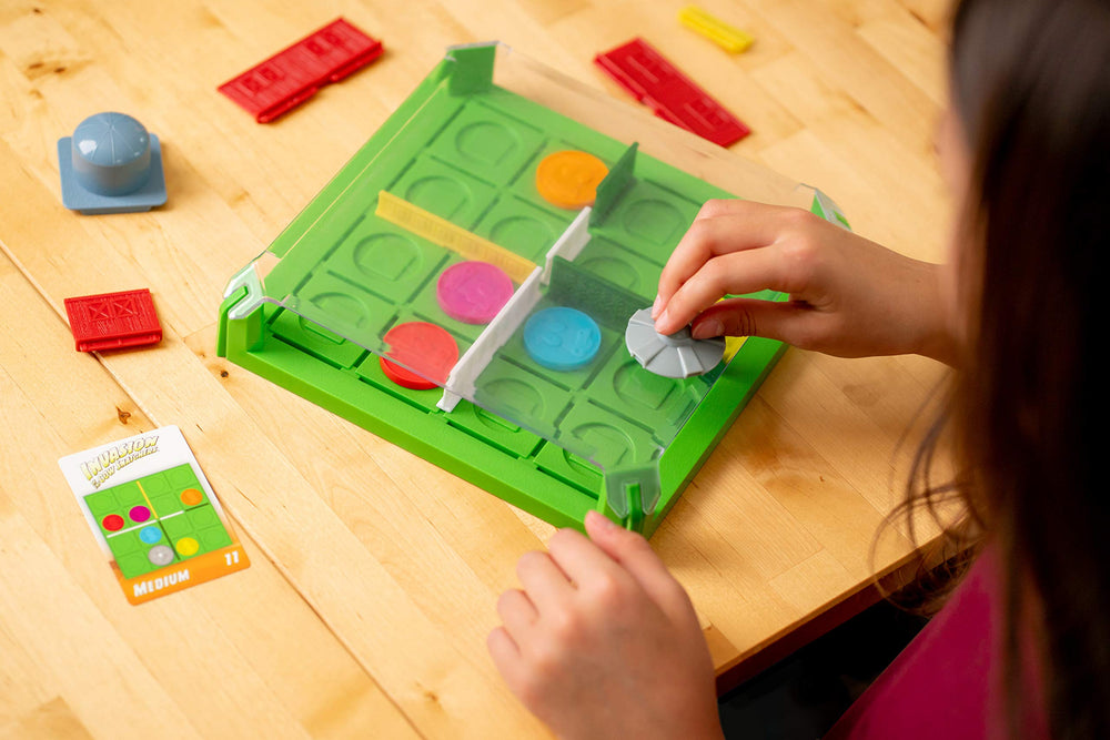 ThinkFun Invasion of the Cow Snatchers magnetic tokens engage fine motor skills during placement.